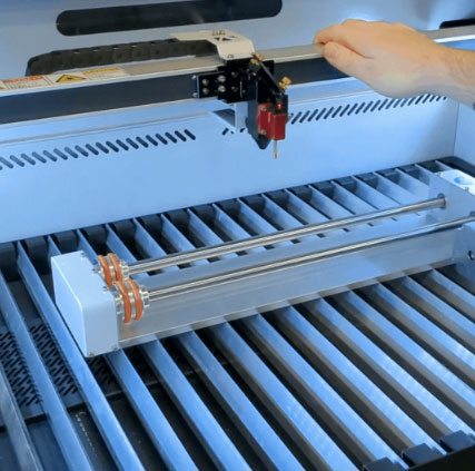 push or pull the gantry over the rotary by hand